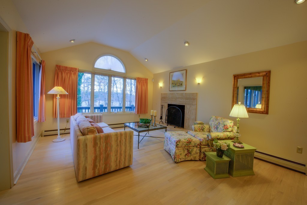 78 Sawmill Road Barnstable, MA 02648 - Photo 21 of 25 a living room with furniture and a fireplace