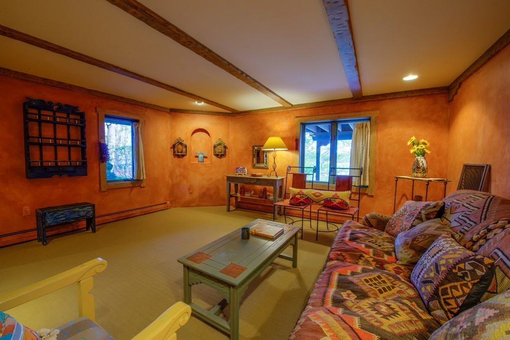 78 Sawmill Road Barnstable, MA 02648 - Photo 24 of 25 a living room with furniture and a flat screen tv