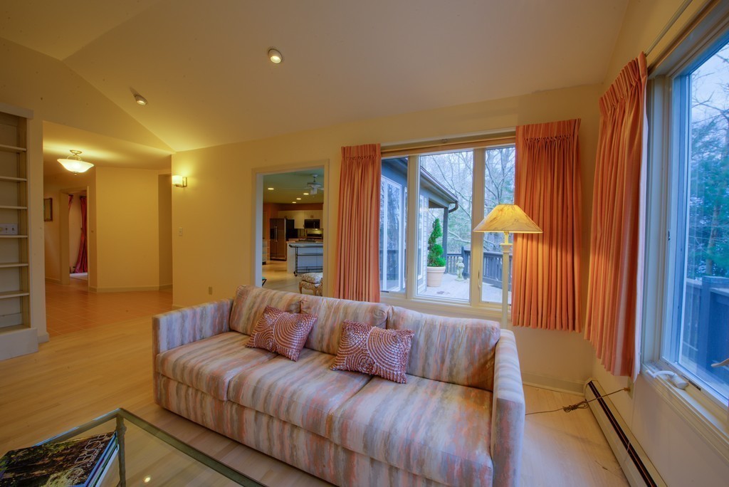 78 Sawmill Road Barnstable, MA 02648 - Photo 3 of 25 a living room with a couch and a potted plant with wooden floor