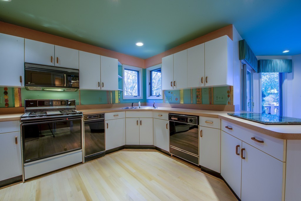 78 Sawmill Road Barnstable, MA 02648 - Photo 6 of 25 a kitchen with stainless steel appliances a stove sink microwave and cabinets