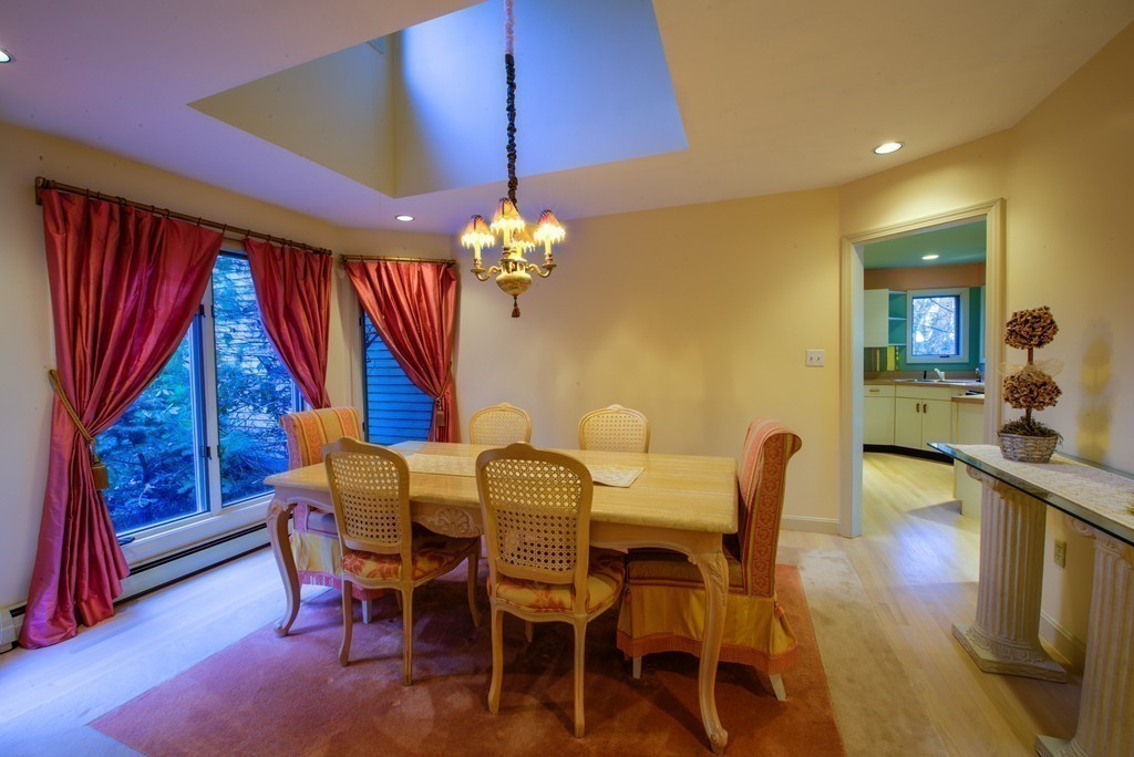 78 Sawmill Road Barnstable, MA 02648 - Photo 9 of 25 a dining room with furniture and chandelier