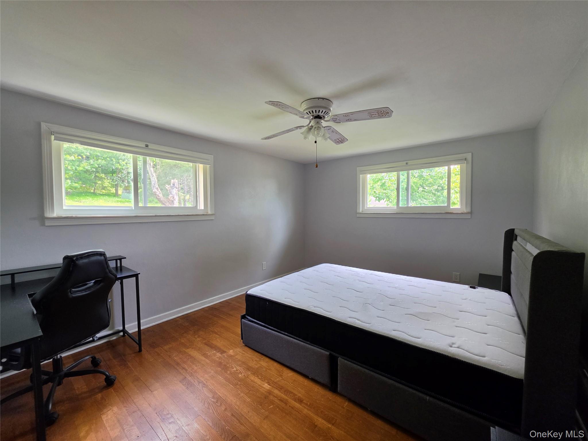 4804 Country Club Road Vestal, NY 13850 - Photo 10 of 15 a bedroom with a bed and a desk