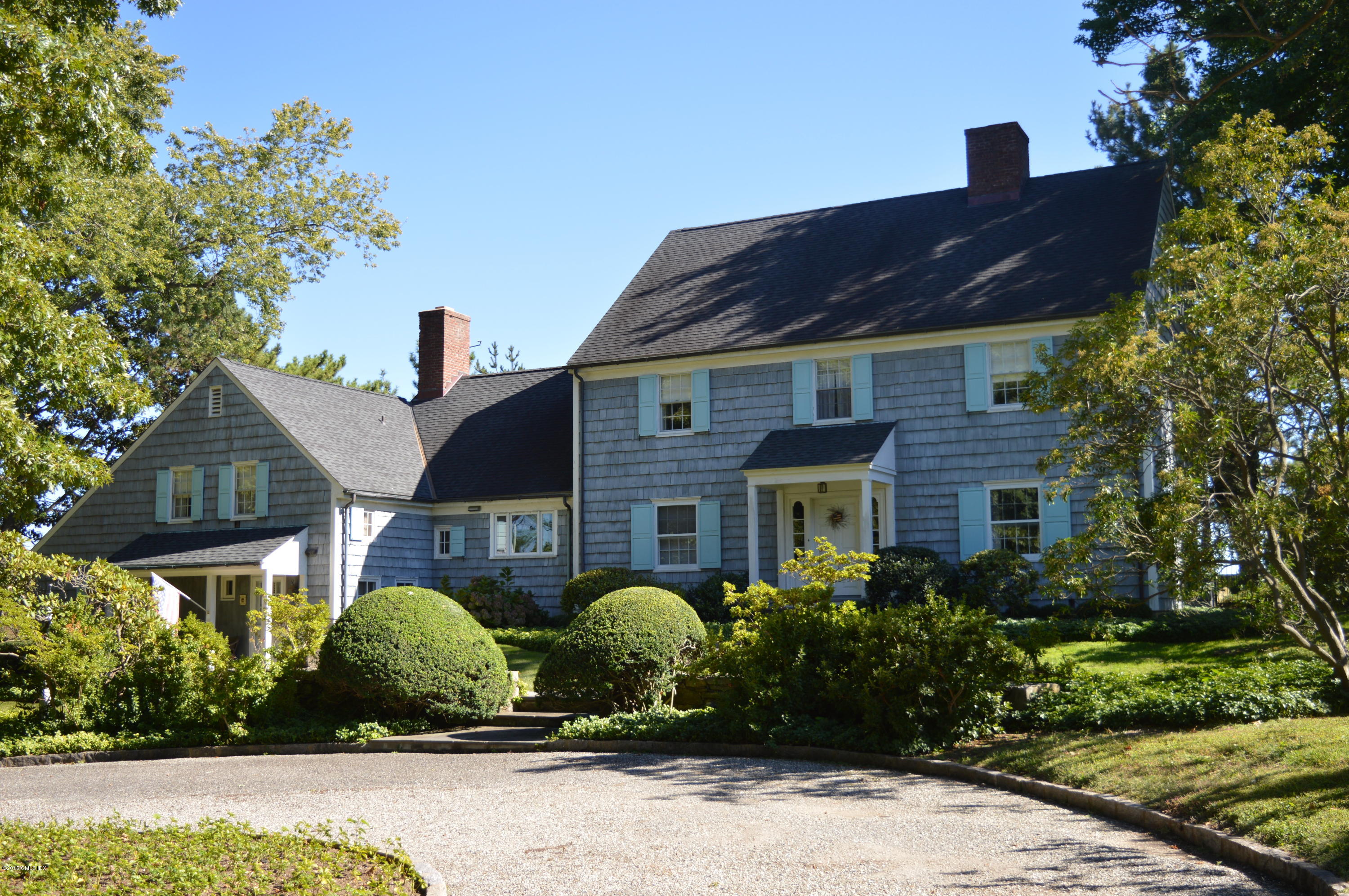 2 Bridle Path Lane Riverside, CT 06878 - Photo 1 of 24 a front view of a house with a garden