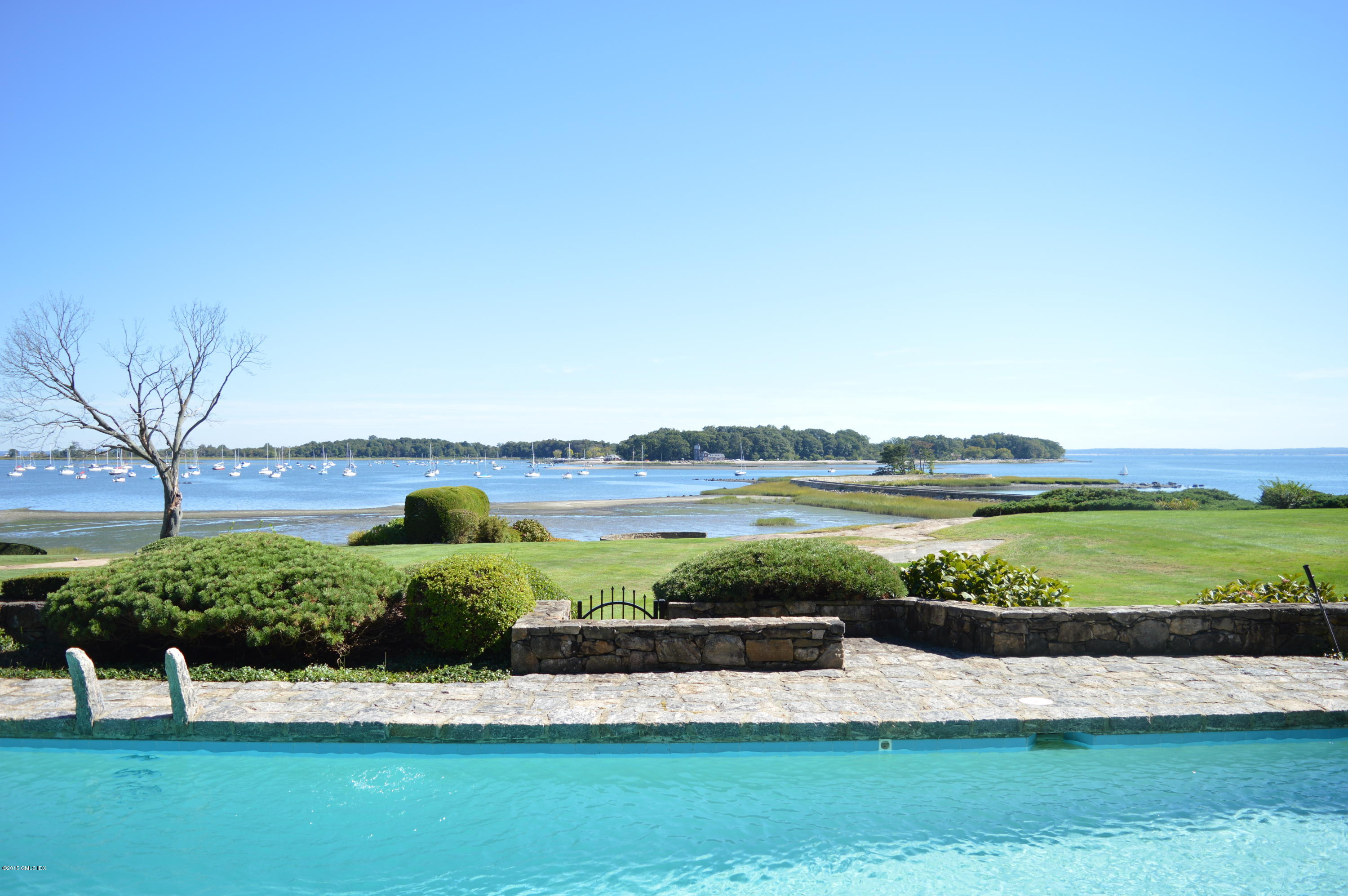 2 Bridle Path Lane Riverside, CT 06878 - Photo 2 of 24 a view of a lake with houses in the back