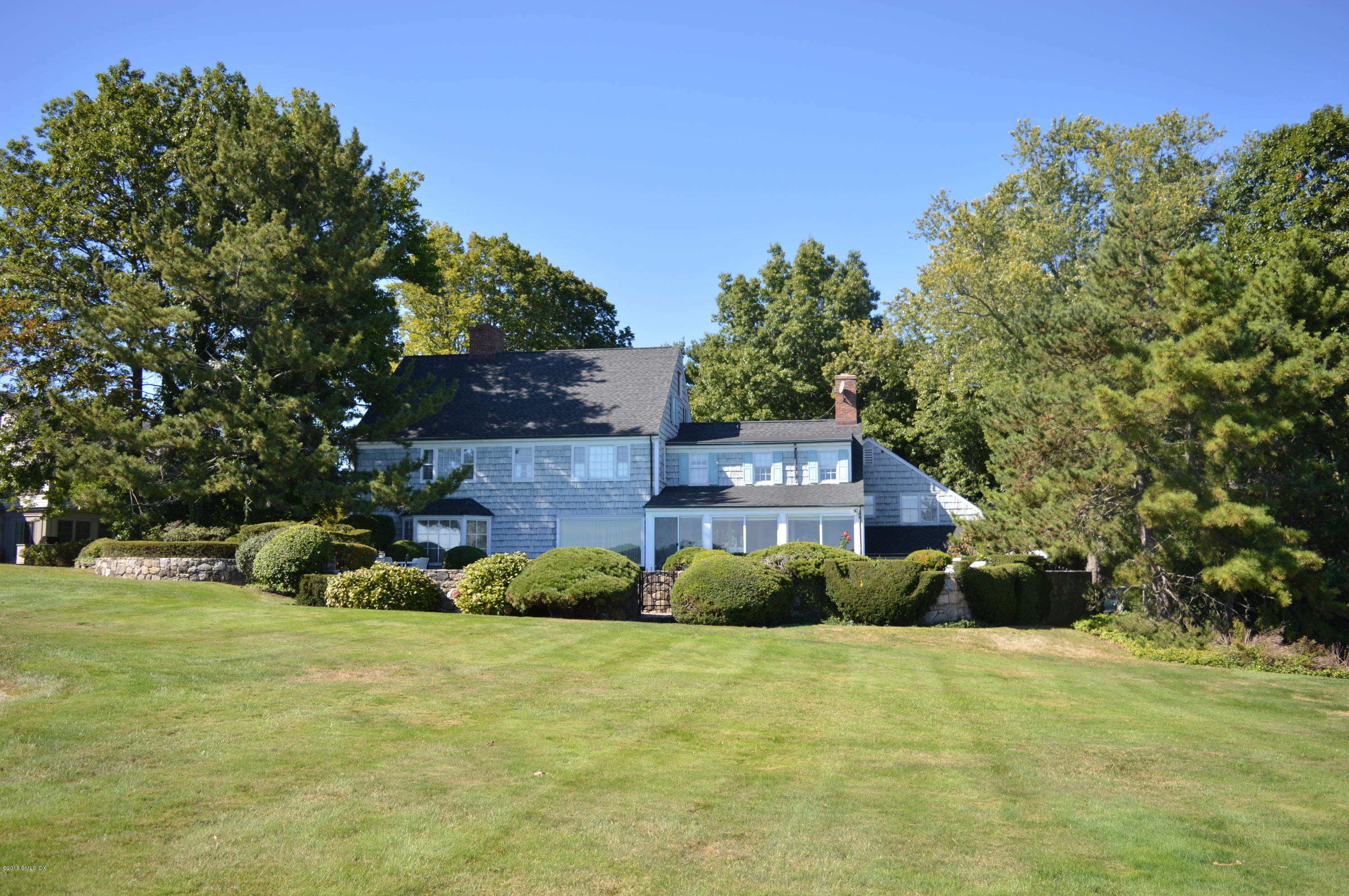 2 Bridle Path Lane Riverside, CT 06878 - Photo 3 of 24 a front view of a house with a yard