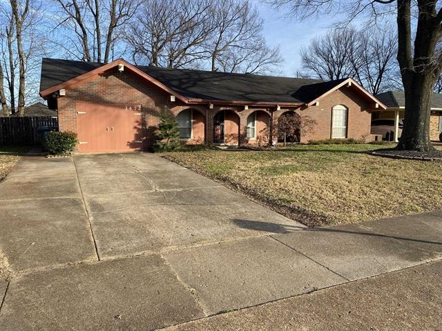 3472 Castleman Street Memphis, TN 38118 - Photo 1 of 30 a front view of a house with garden