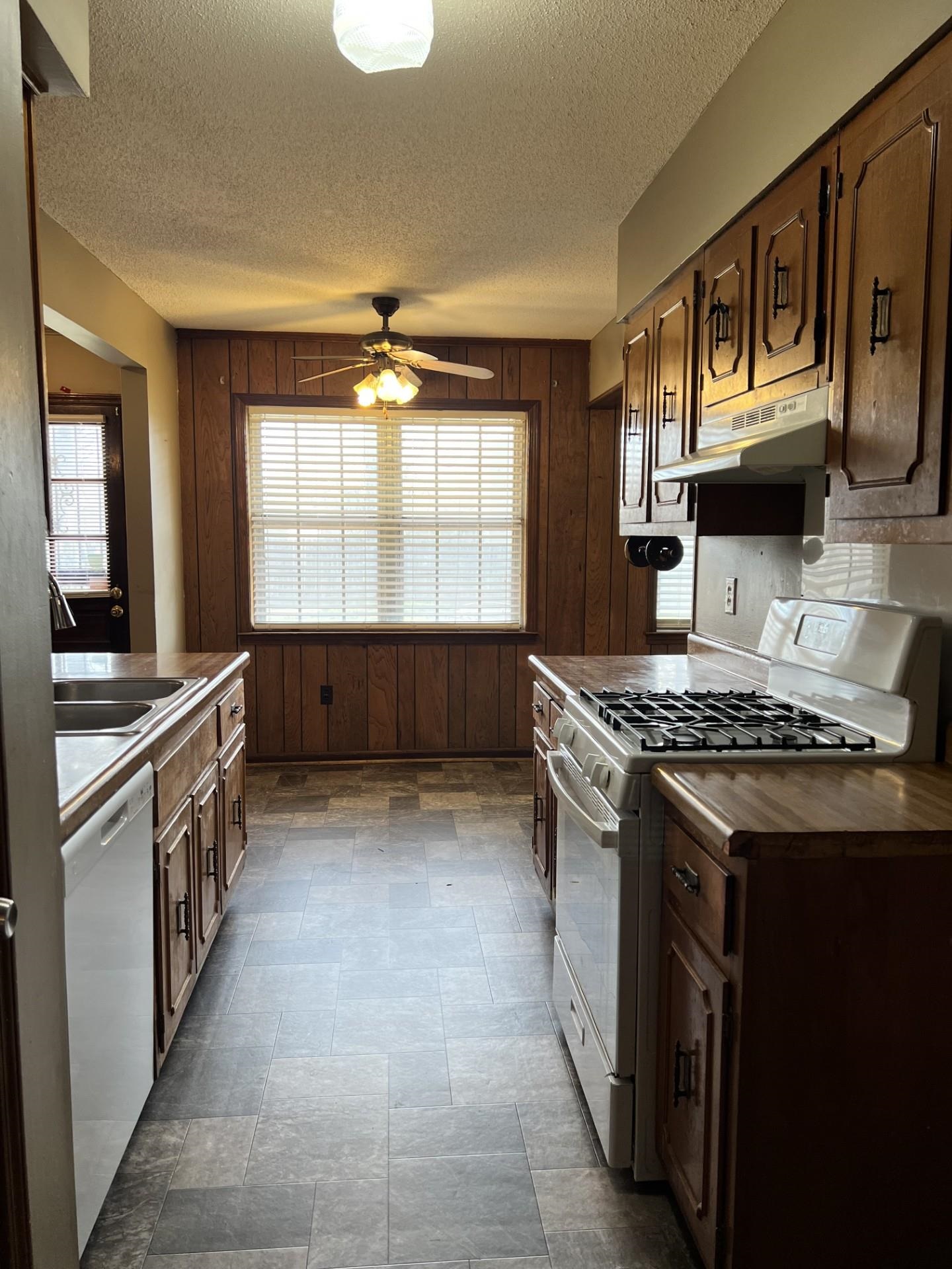 3472 Castleman Street Memphis, TN 38118 - Photo 11 of 30 a kitchen with stainless steel appliances granite countertop a stove and a sink