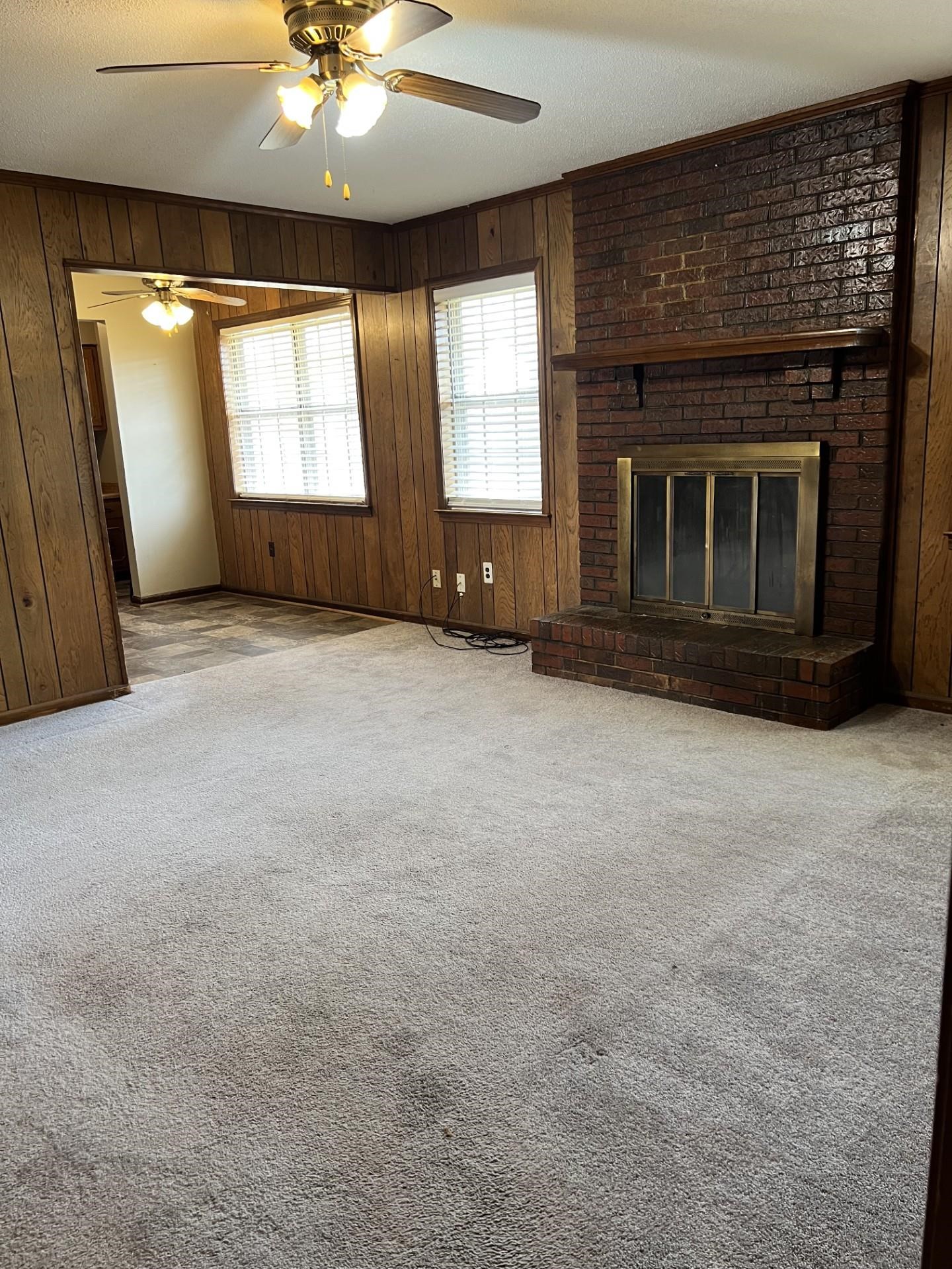 3472 Castleman Street Memphis, TN 38118 - Photo 9 of 30 an empty room with windows and fireplace