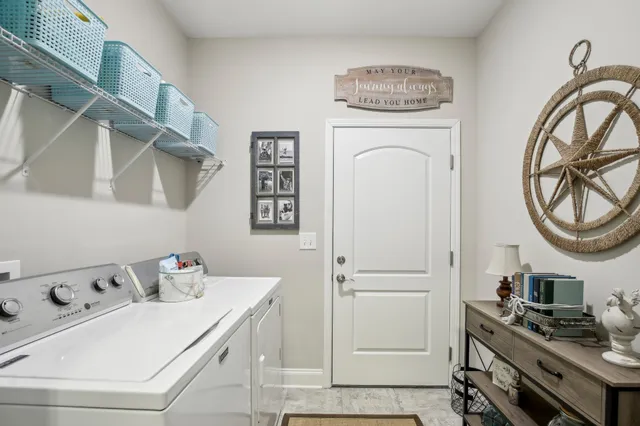a bedroom with a bed a couch and a large window with the outer view