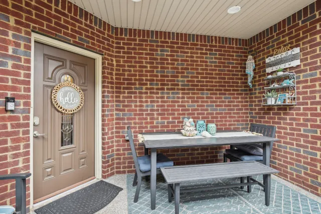 a view of a room with a table and a chair