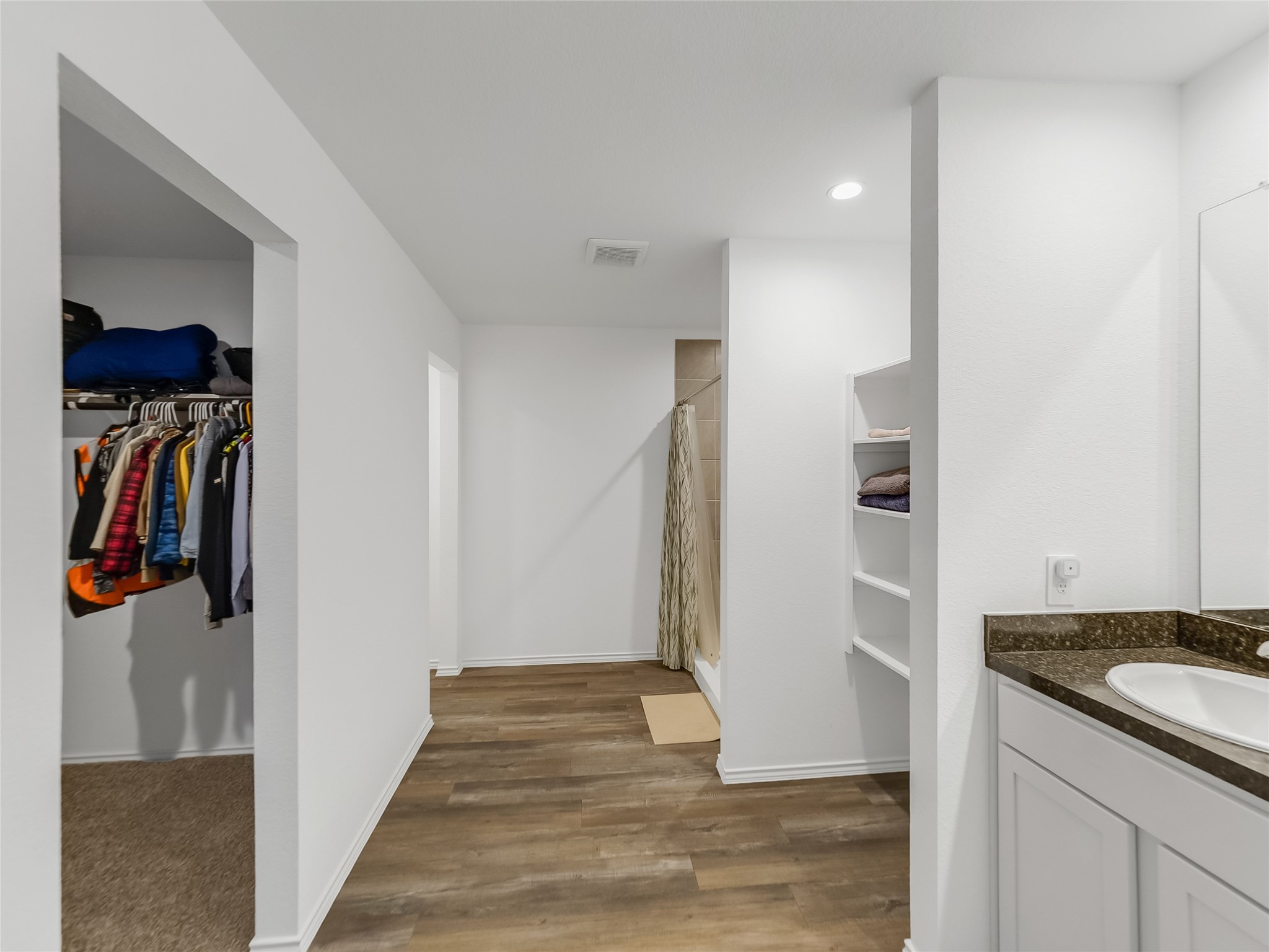 40422 Basalt Elm Road Magnolia, TX 77354 - Photo 11 of 27 a view of a walk in closet and bathroom
