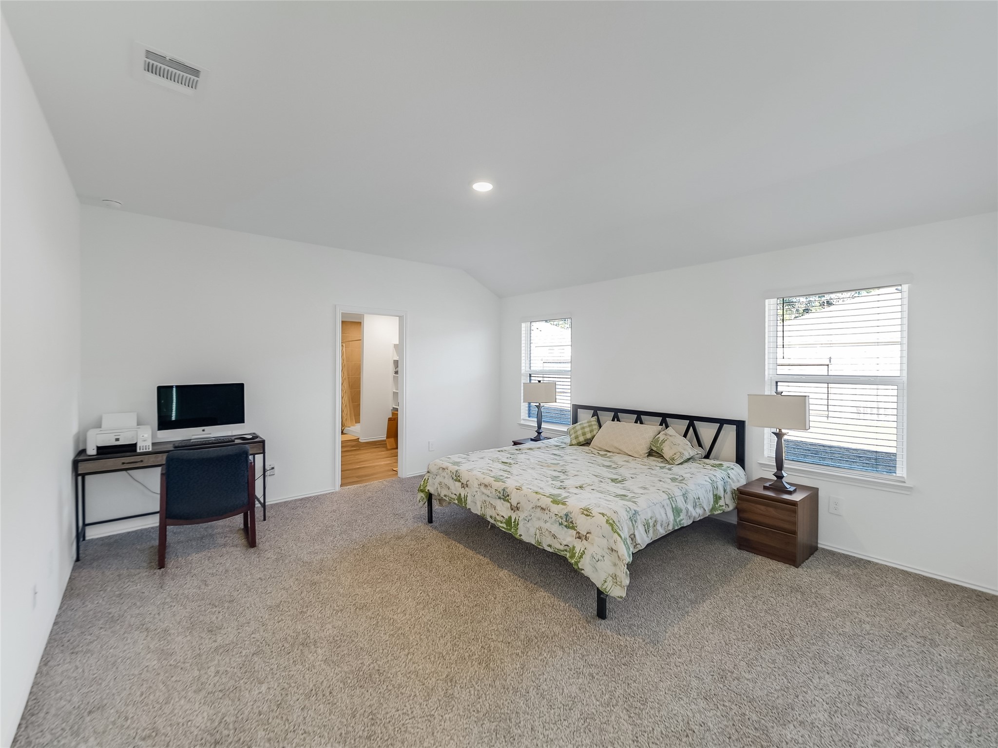 40422 Basalt Elm Road Magnolia, TX 77354 - Photo 15 of 27 a spacious bedroom with a bed and a desk in it