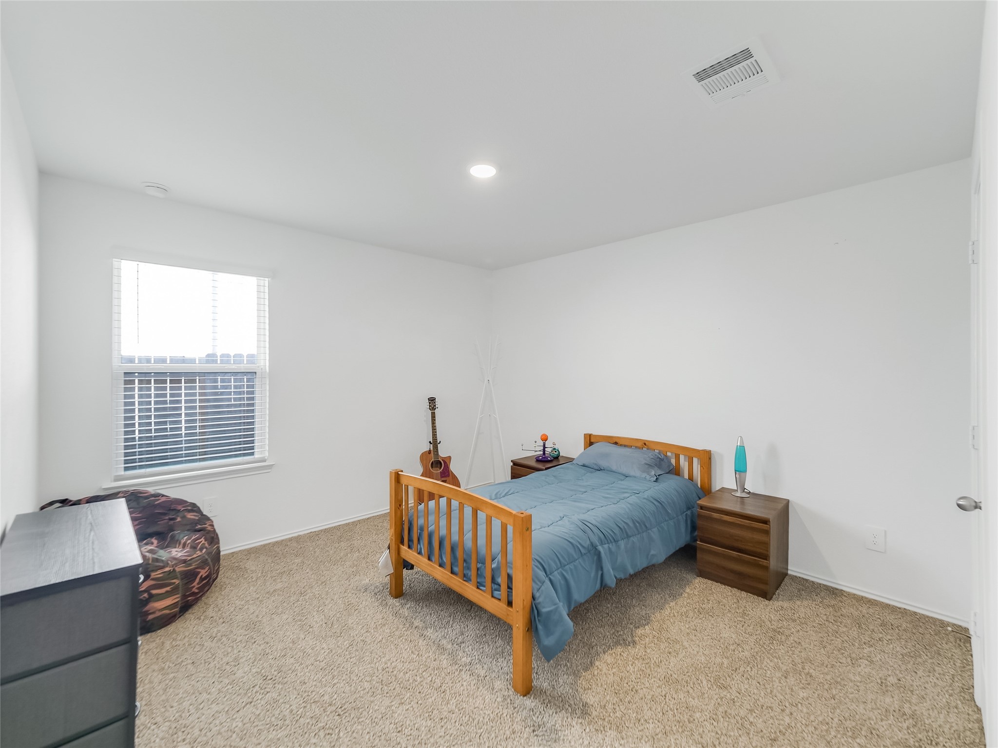 40422 Basalt Elm Road Magnolia, TX 77354 - Photo 20 of 27 a bedroom with bed and a window