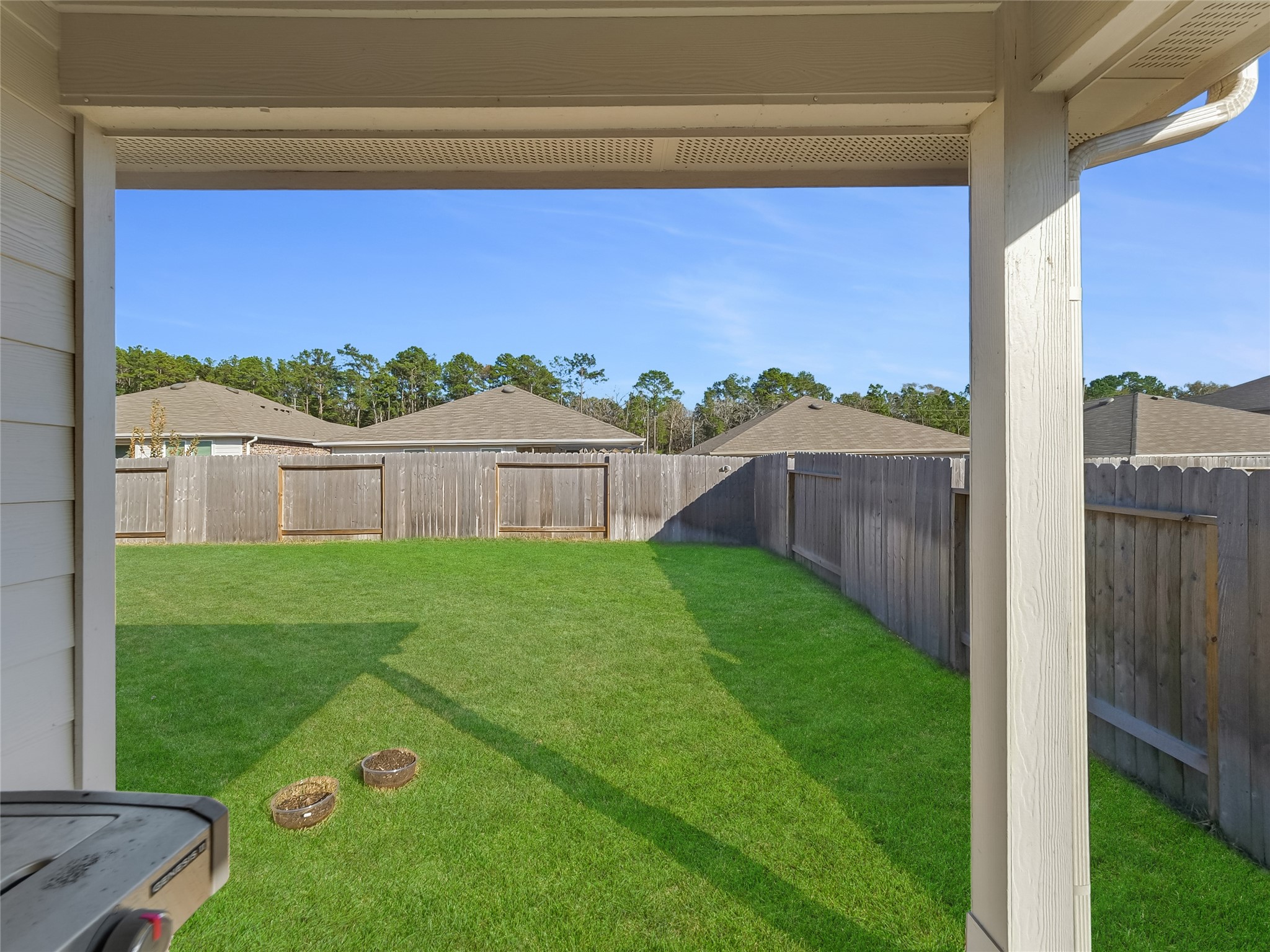 40422 Basalt Elm Road Magnolia, TX 77354 - Photo 23 of 27 a view of a backyard with a garden and deck