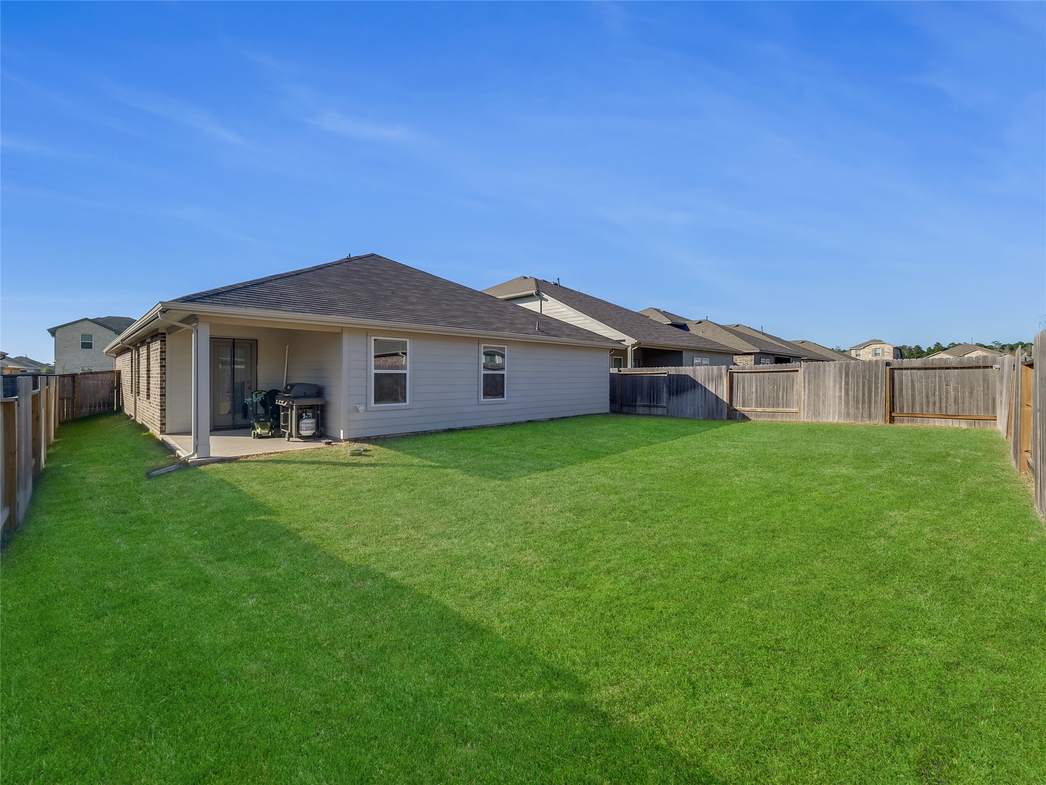 40422 Basalt Elm Road Magnolia, TX 77354 - Photo 25 of 27 a view of a house with a backyard