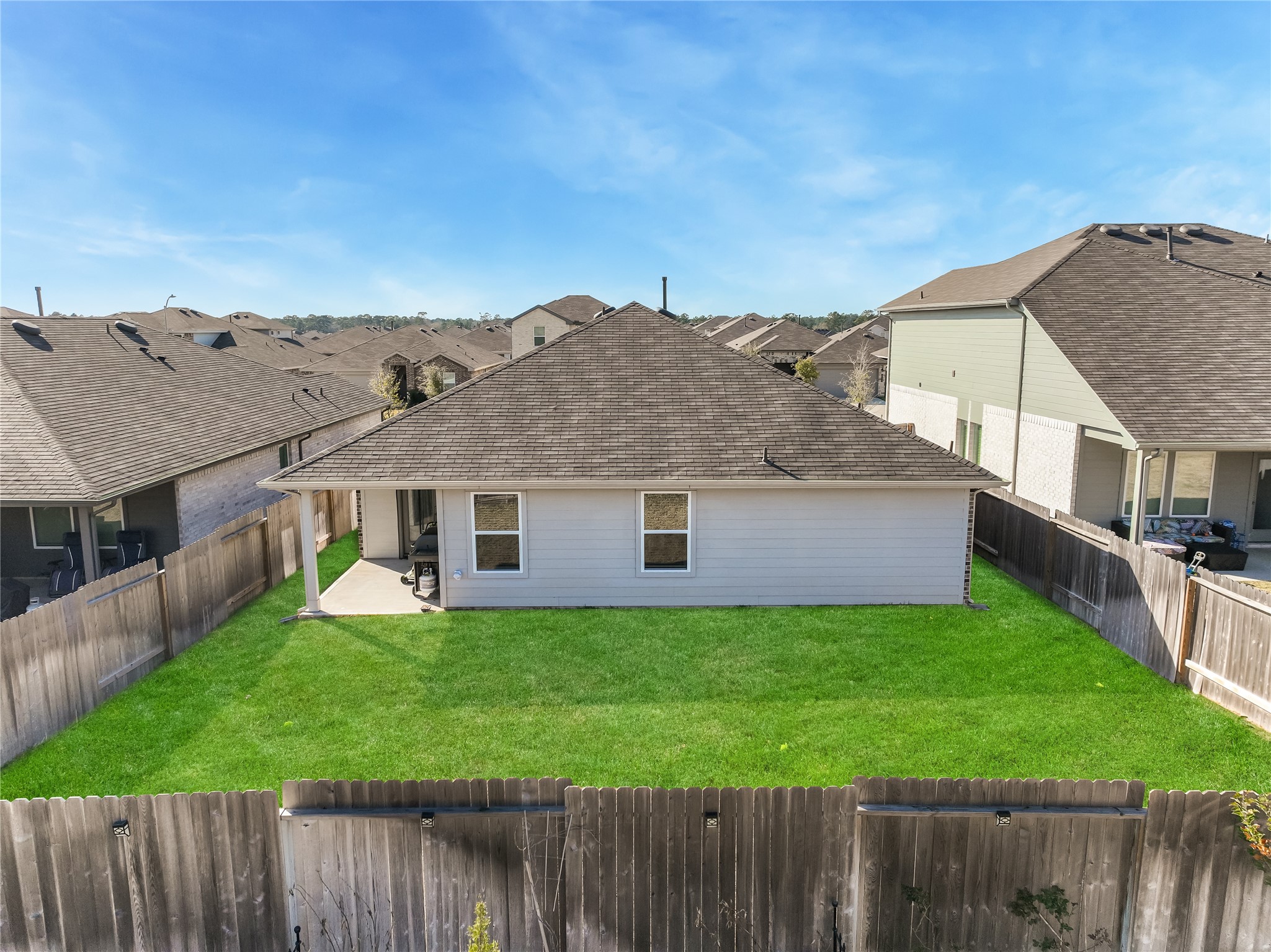 40422 Basalt Elm Road Magnolia, TX 77354 - Photo 27 of 27 a view of a house with a yard and deck