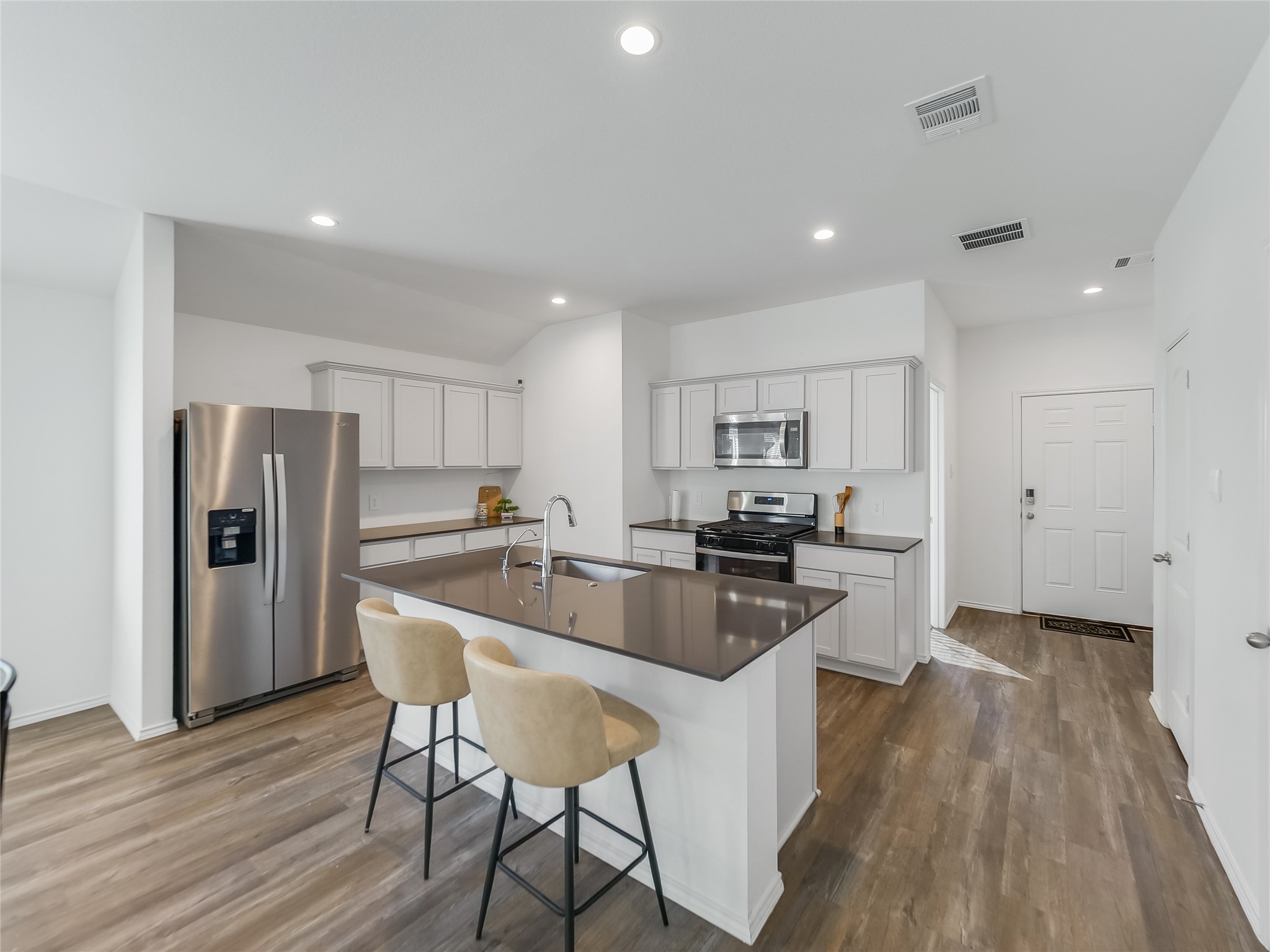 40422 Basalt Elm Road Magnolia, TX 77354 - Photo 6 of 27 a kitchen with refrigerator and wooden floor