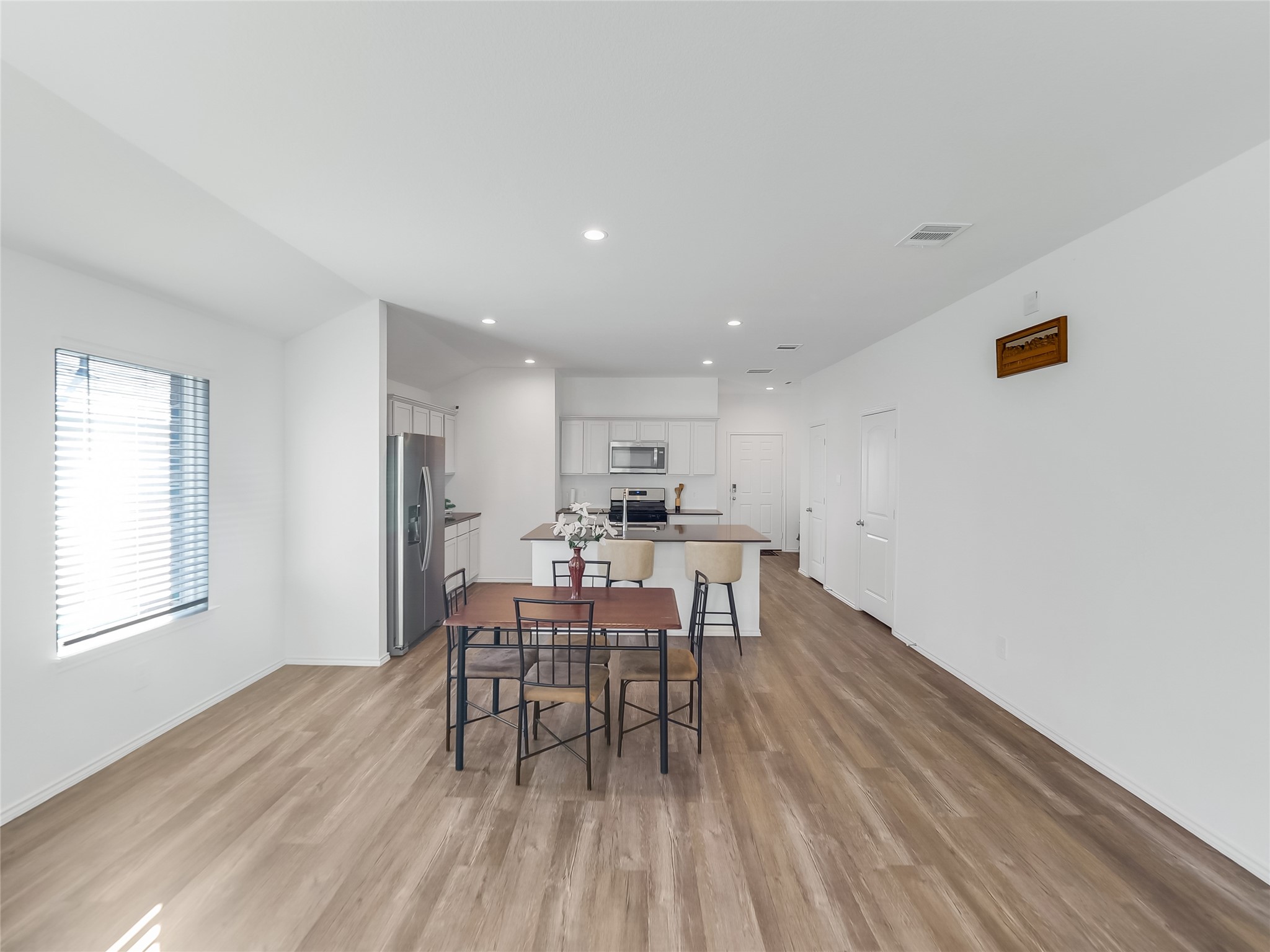 40422 Basalt Elm Road Magnolia, TX 77354 - Photo 8 of 27 a dining room with furniture and wooden floor