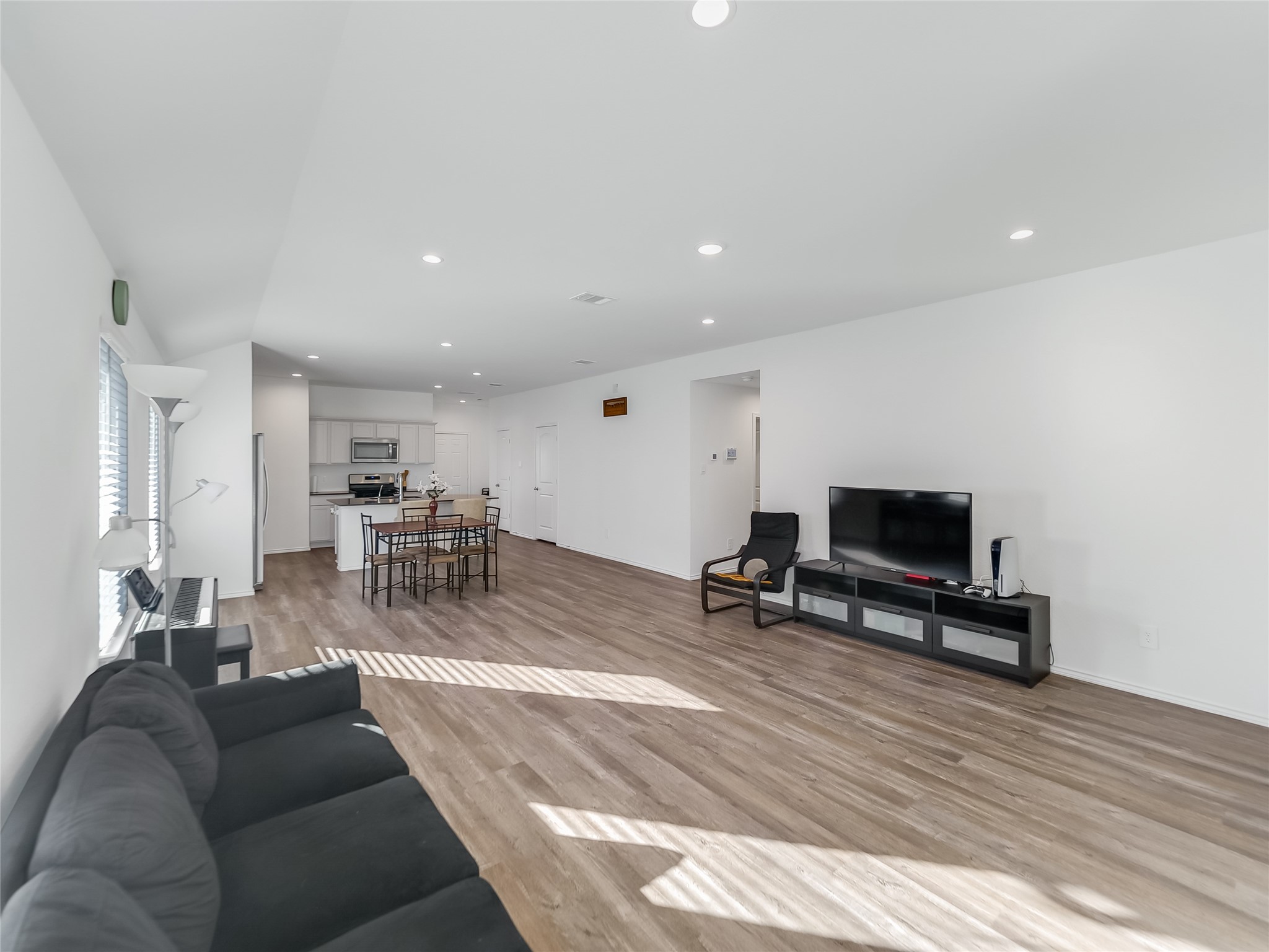 40422 Basalt Elm Road Magnolia, TX 77354 - Photo 9 of 27 a living room with furniture a table and a flat screen tv