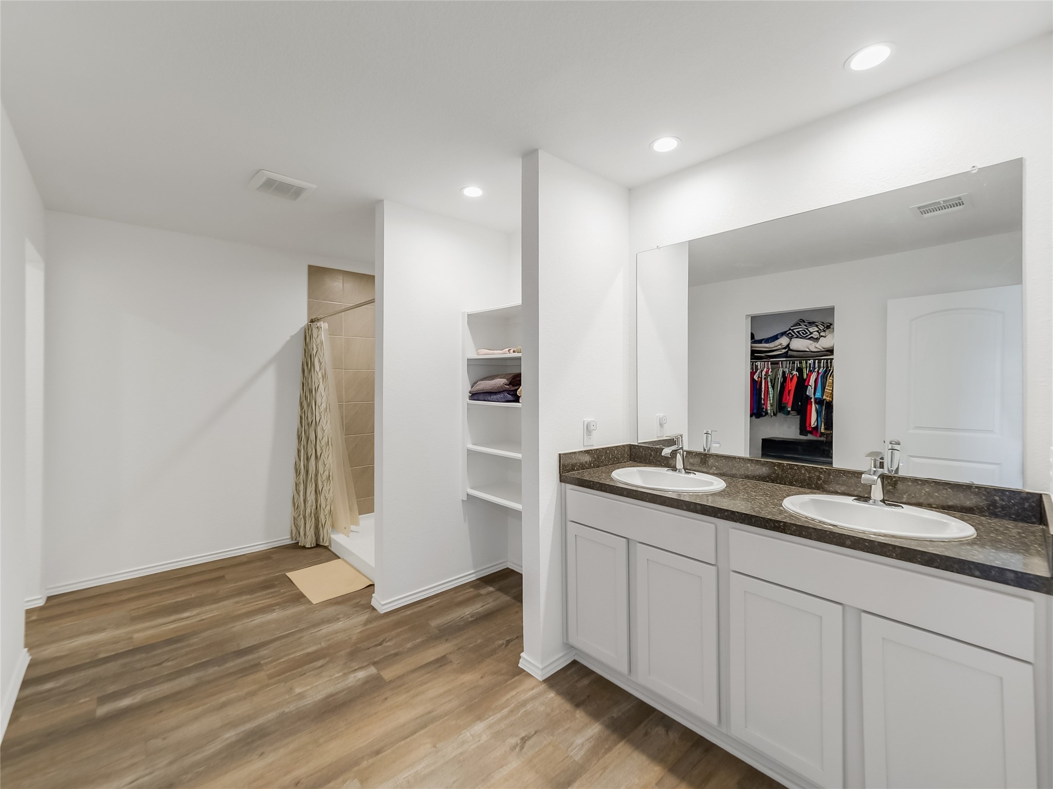 40422 Basalt Elm Road Magnolia, TX 77354 - Photo 10 of 27 a bathroom with a granite countertop sink and a mirror