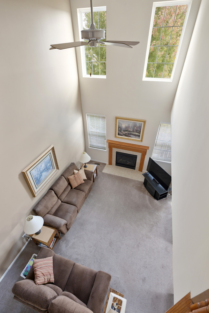 1127 Pine Valley Court Elgin, IL 60124 - Photo 11 of 27 a living room with furniture and a window