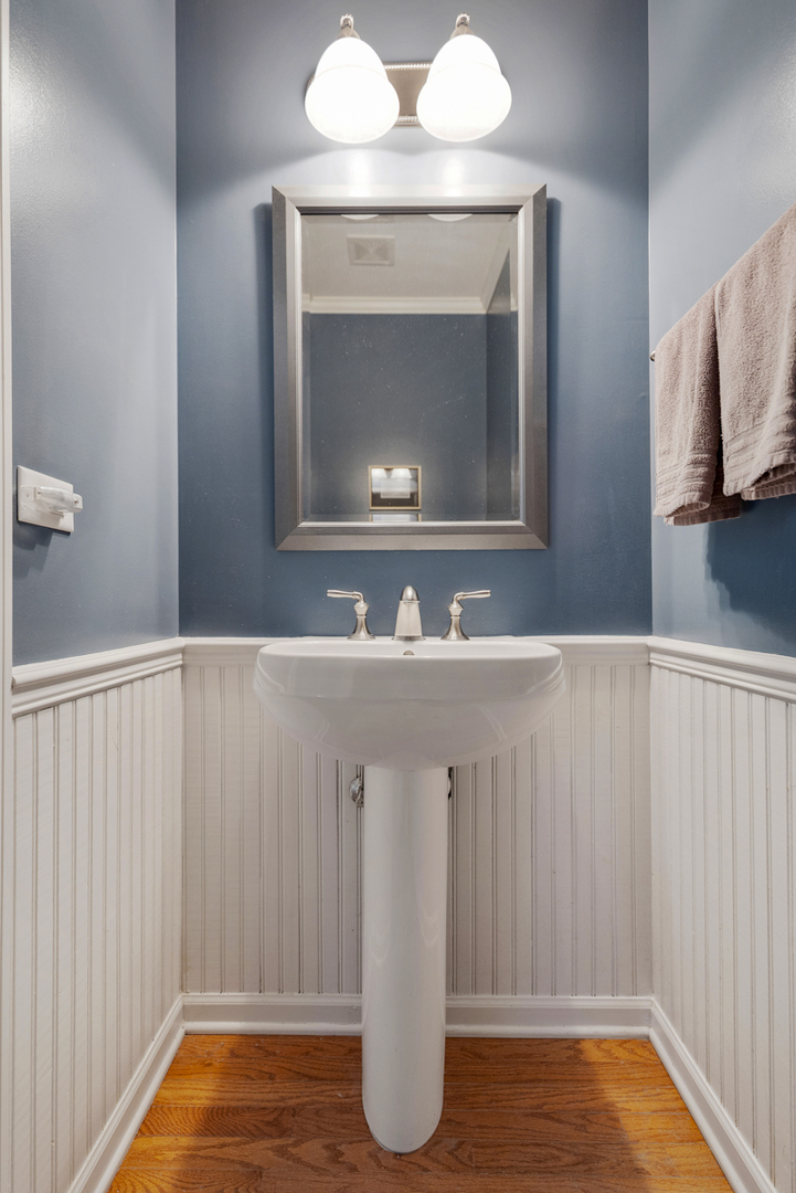 1127 Pine Valley Court Elgin, IL 60124 - Photo 13 of 27 a bathroom with a sink and a mirror