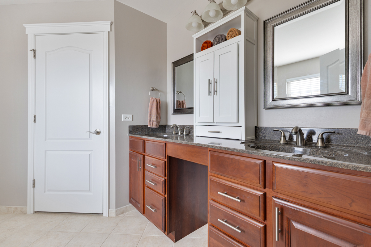 1127 Pine Valley Court Elgin, IL 60124 - Photo 15 of 27 a bathroom with a sink and a mirror