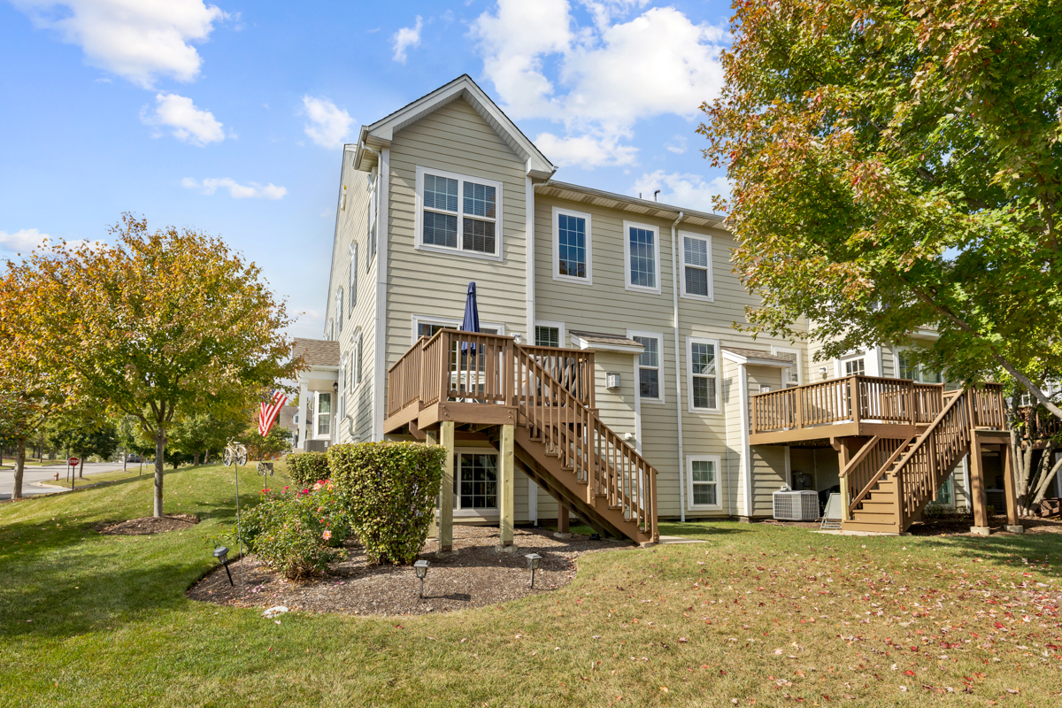 1127 Pine Valley Court Elgin, IL 60124 - Photo 26 of 27 a view of a house with a yard