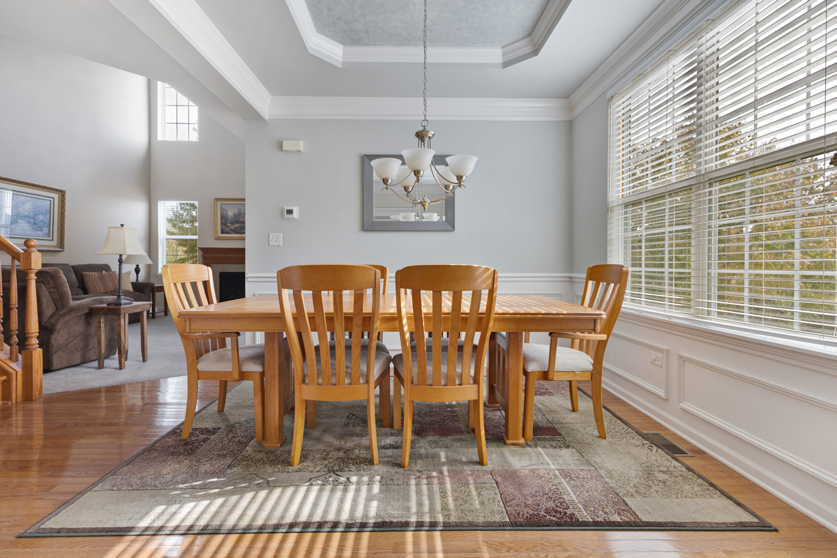 1127 Pine Valley Court Elgin, IL 60124 - Photo 4 of 27 a view of a dining room with furniture window and wooden floor