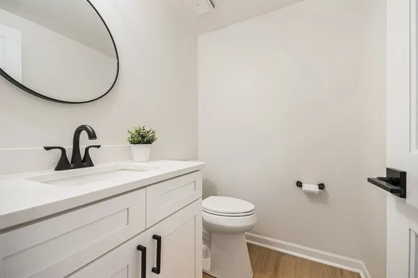 a bathroom with a sink and mirror