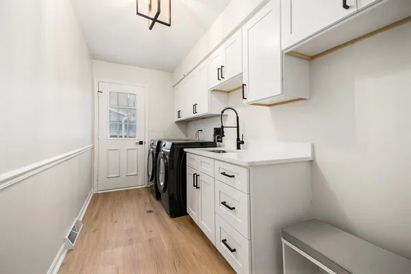a kitchen with cabinets appliances and a counter space