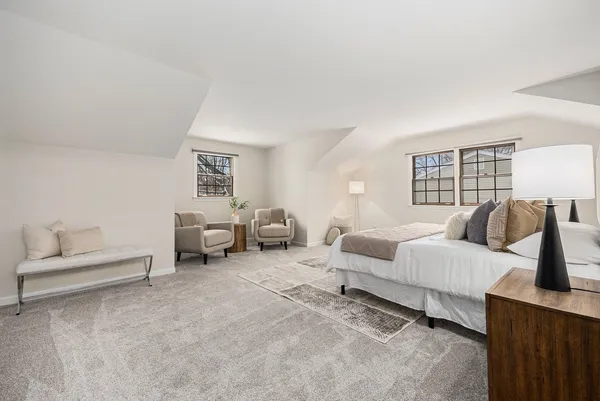 a living room with furniture and a lamp