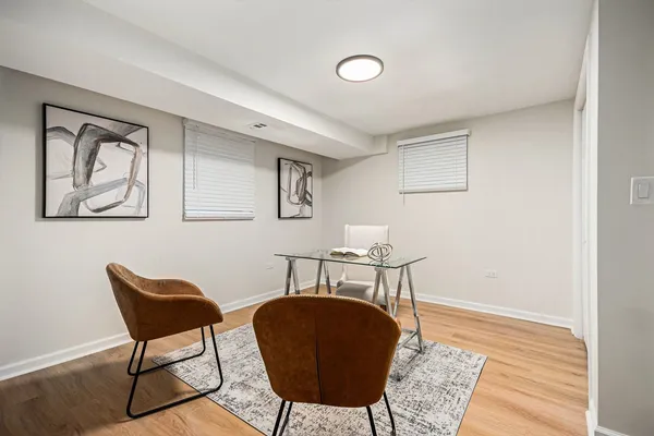 a workspace with furniture and wooden floor