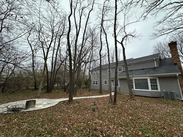a backyard of a house with lots of green space