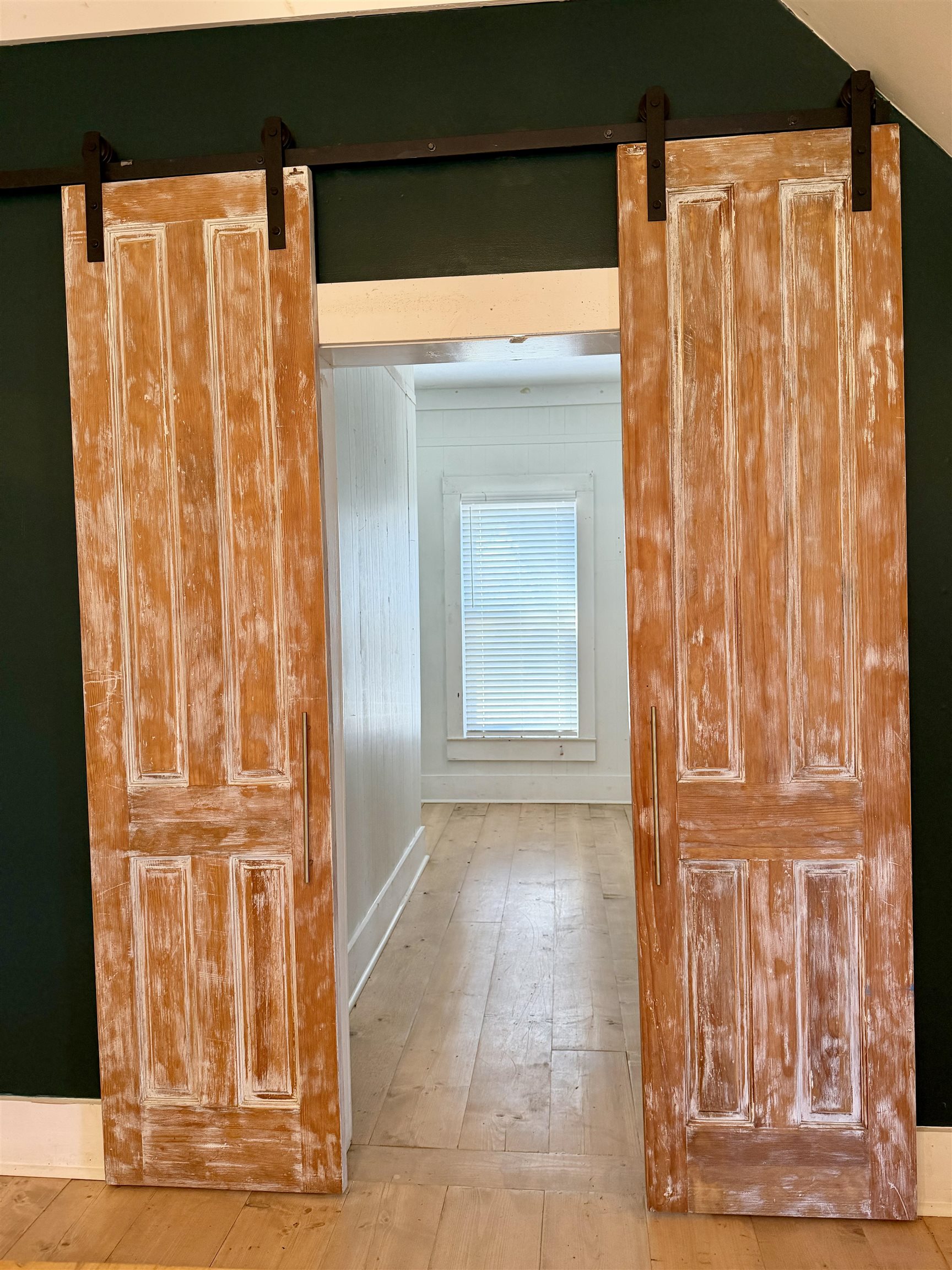 160 Chewalla Road Ramer, TN 38367 - Photo 14 of 39 Hallway featuring a barn door and light wood-style floors