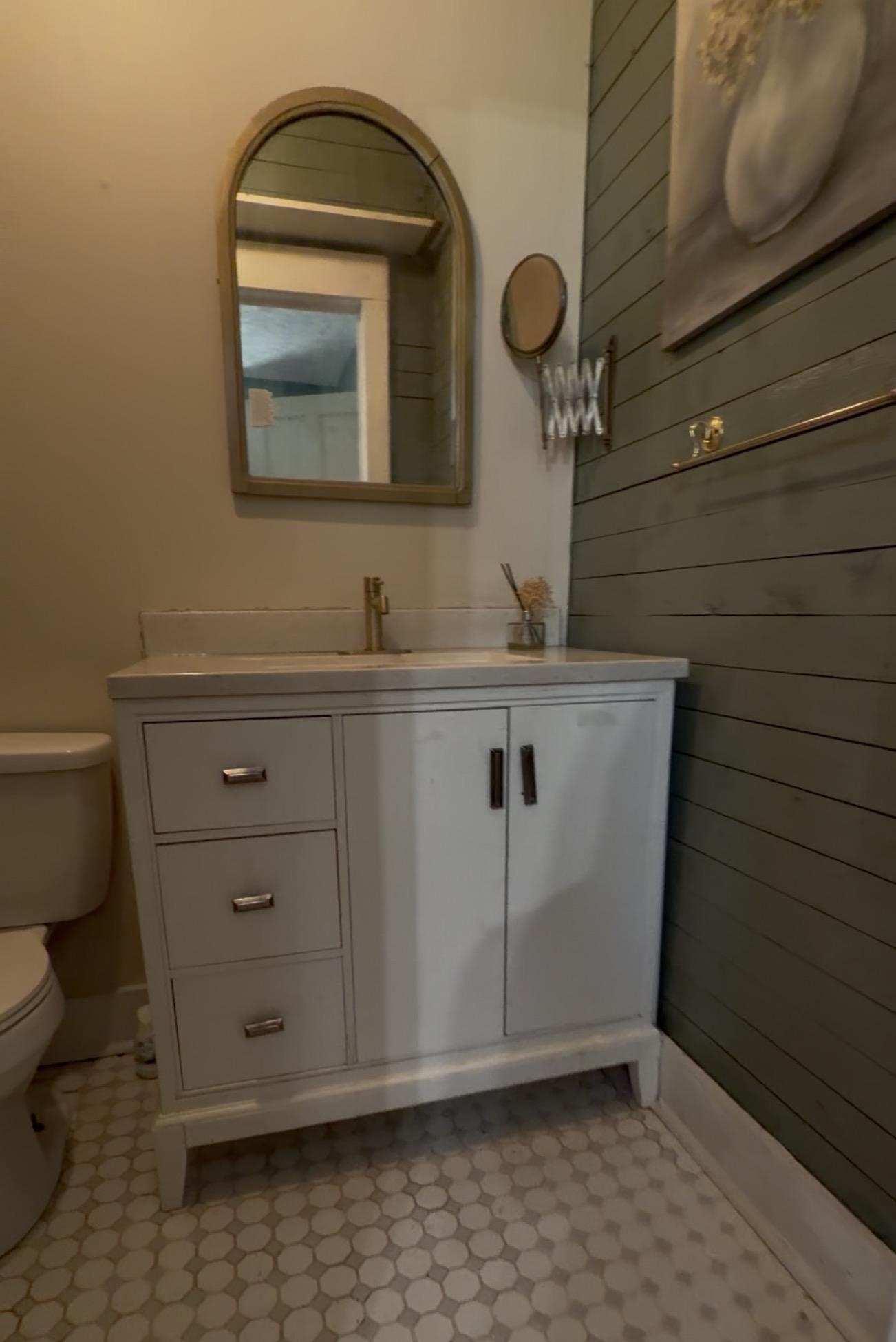 160 Chewalla Road Ramer, TN 38367 - Photo 18 of 39 Bathroom featuring vanity, wood walls, and light flooring
