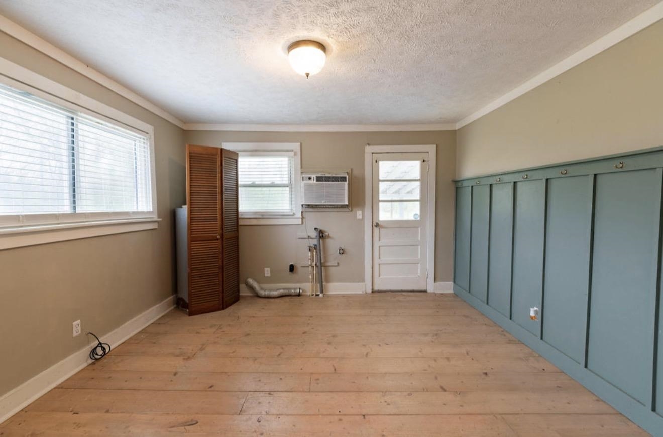 160 Chewalla Road Ramer, TN 38367 - Photo 29 of 39 Interior space featuring light wood-type flooring, crown molding, and a textured ceiling