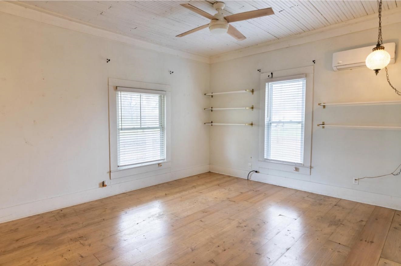160 Chewalla Road Ramer, TN 38367 - Photo 6 of 39 Spare room with light wood finished floors, wooden ceiling, and ceiling fan