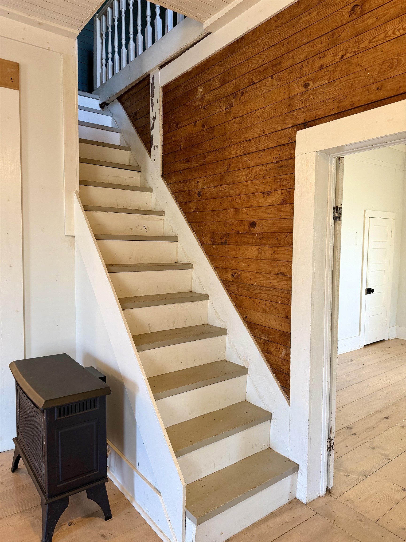 160 Chewalla Road Ramer, TN 38367 - Photo 7 of 39 Stairway with hardwood / wood-style floors and wood walls
