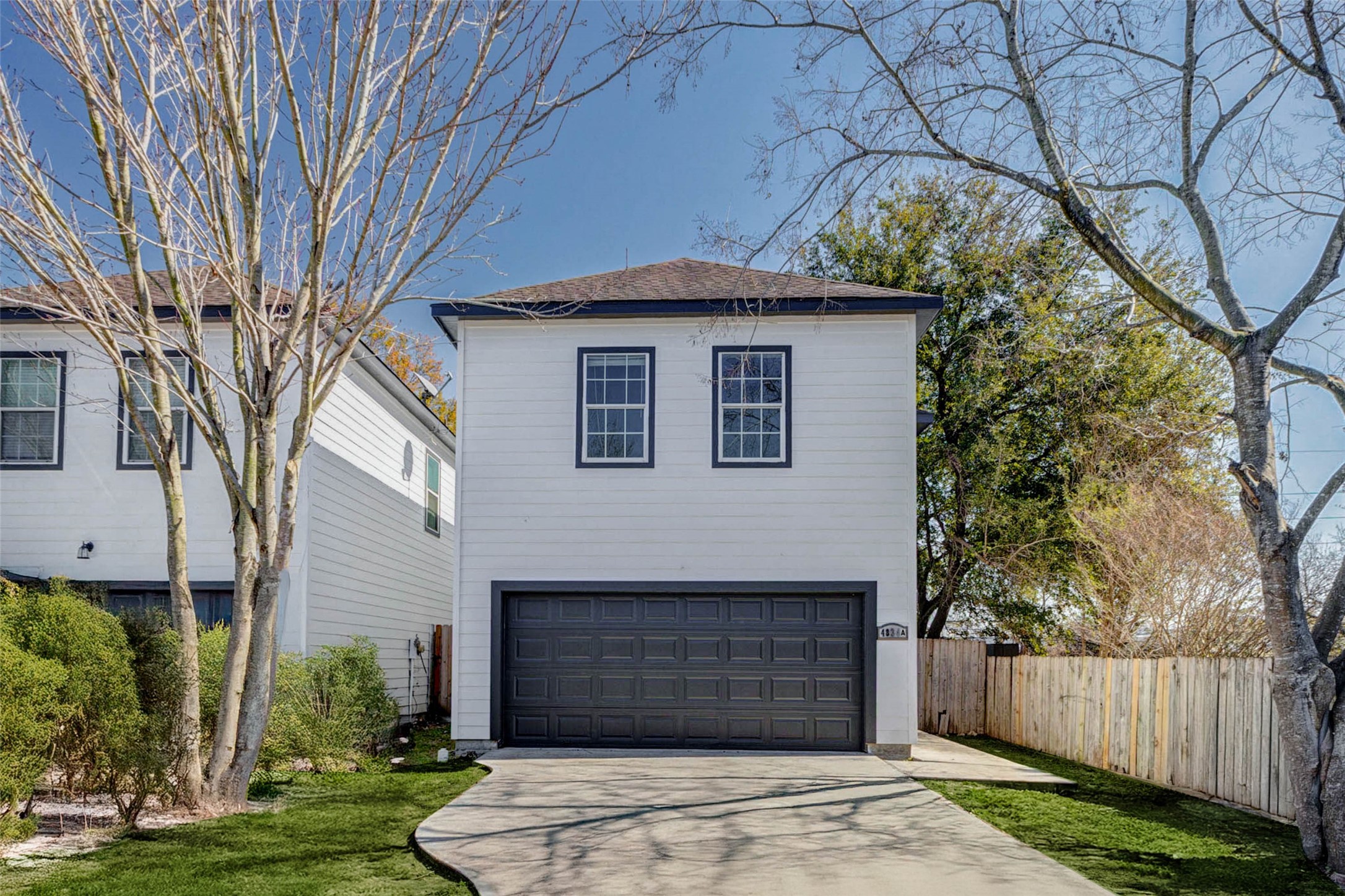 4834 Hollow Hook Road, Unit A Houston, TX 77041 - Photo 1 of 30 a front view of a house with a yard