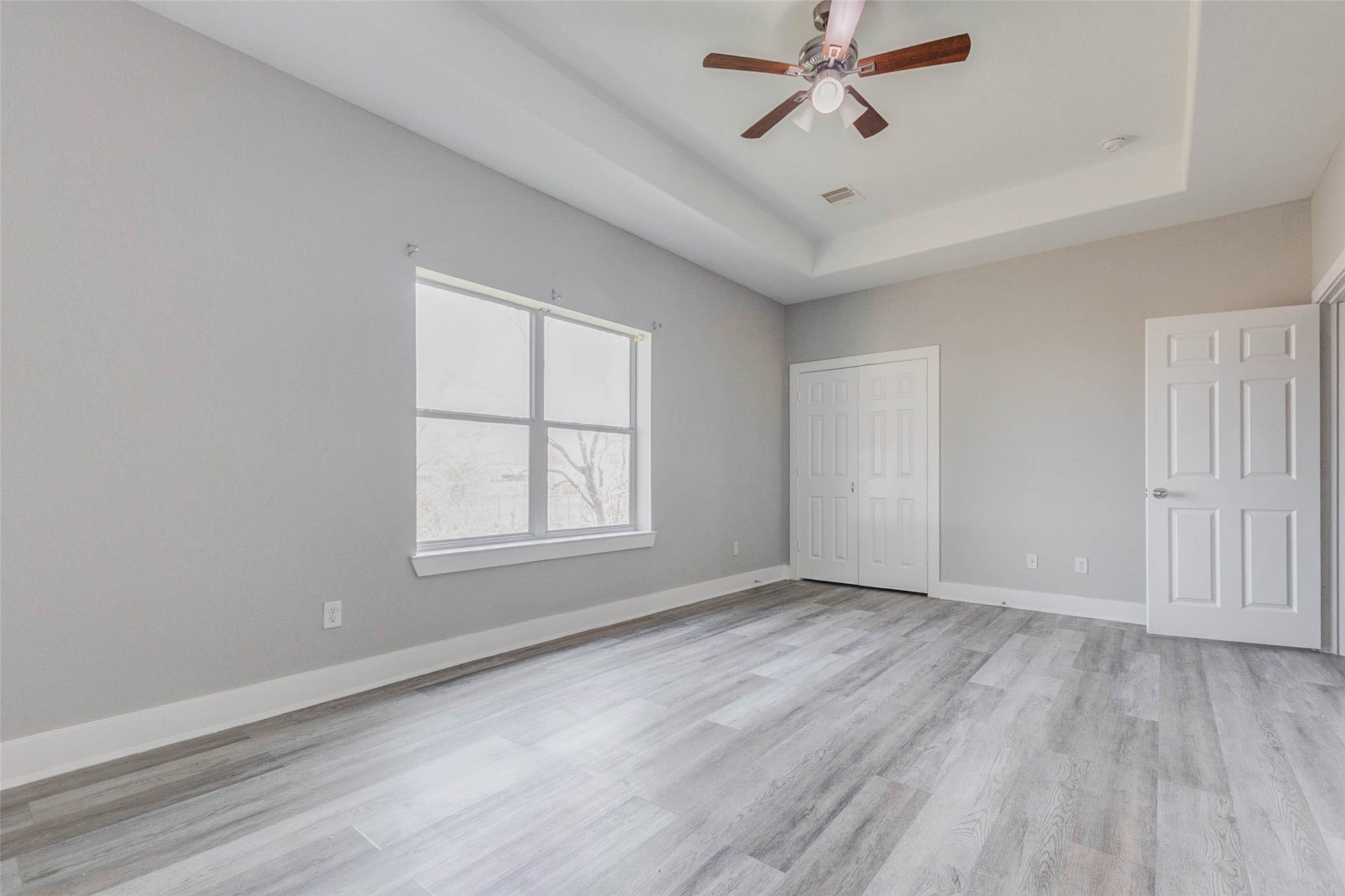 4834 Hollow Hook Road, Unit A Houston, TX 77041 - Photo 13 of 30 wooden floor in an empty room with a window