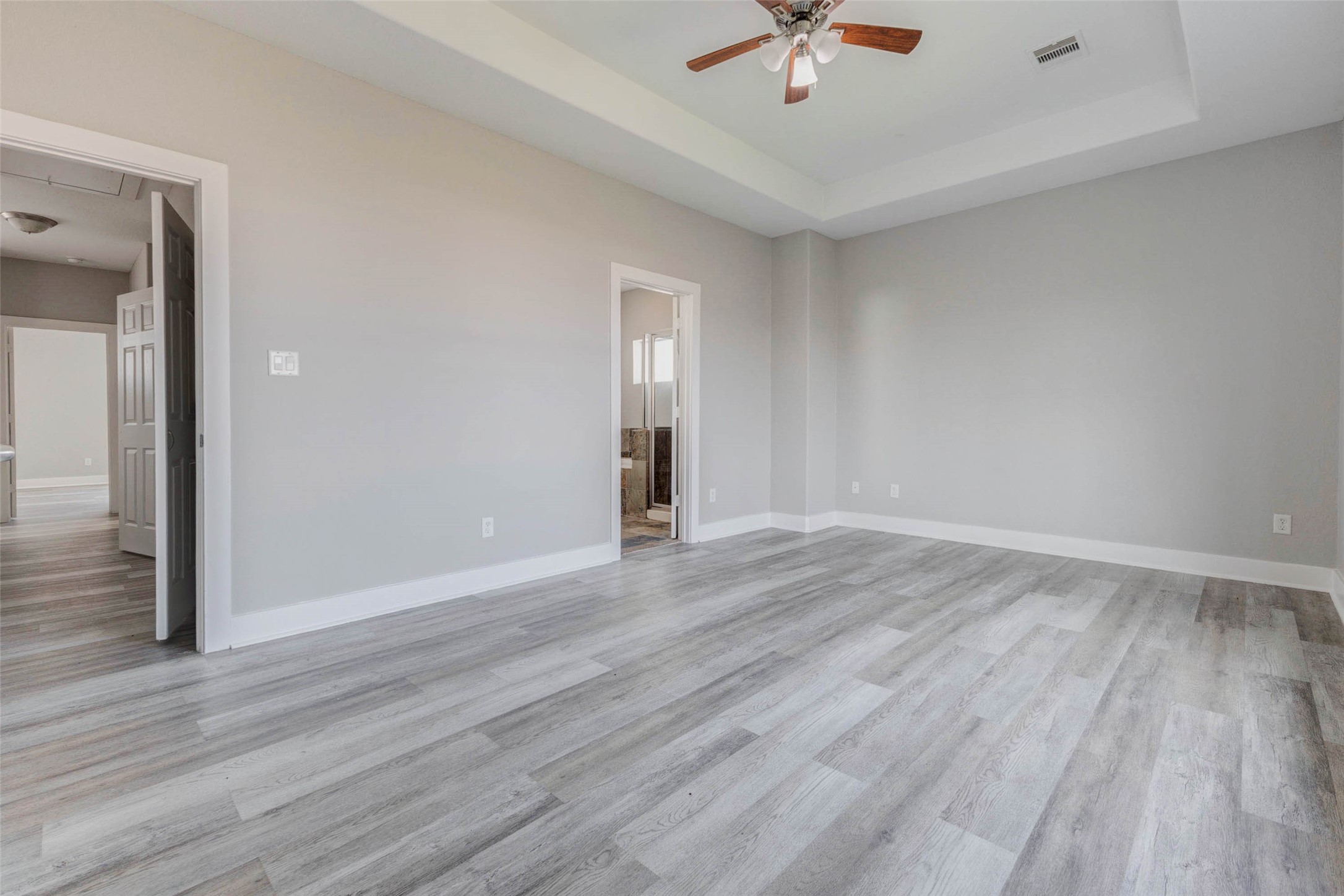 4834 Hollow Hook Road, Unit A Houston, TX 77041 - Photo 14 of 30 wooden floor in an empty room with a window