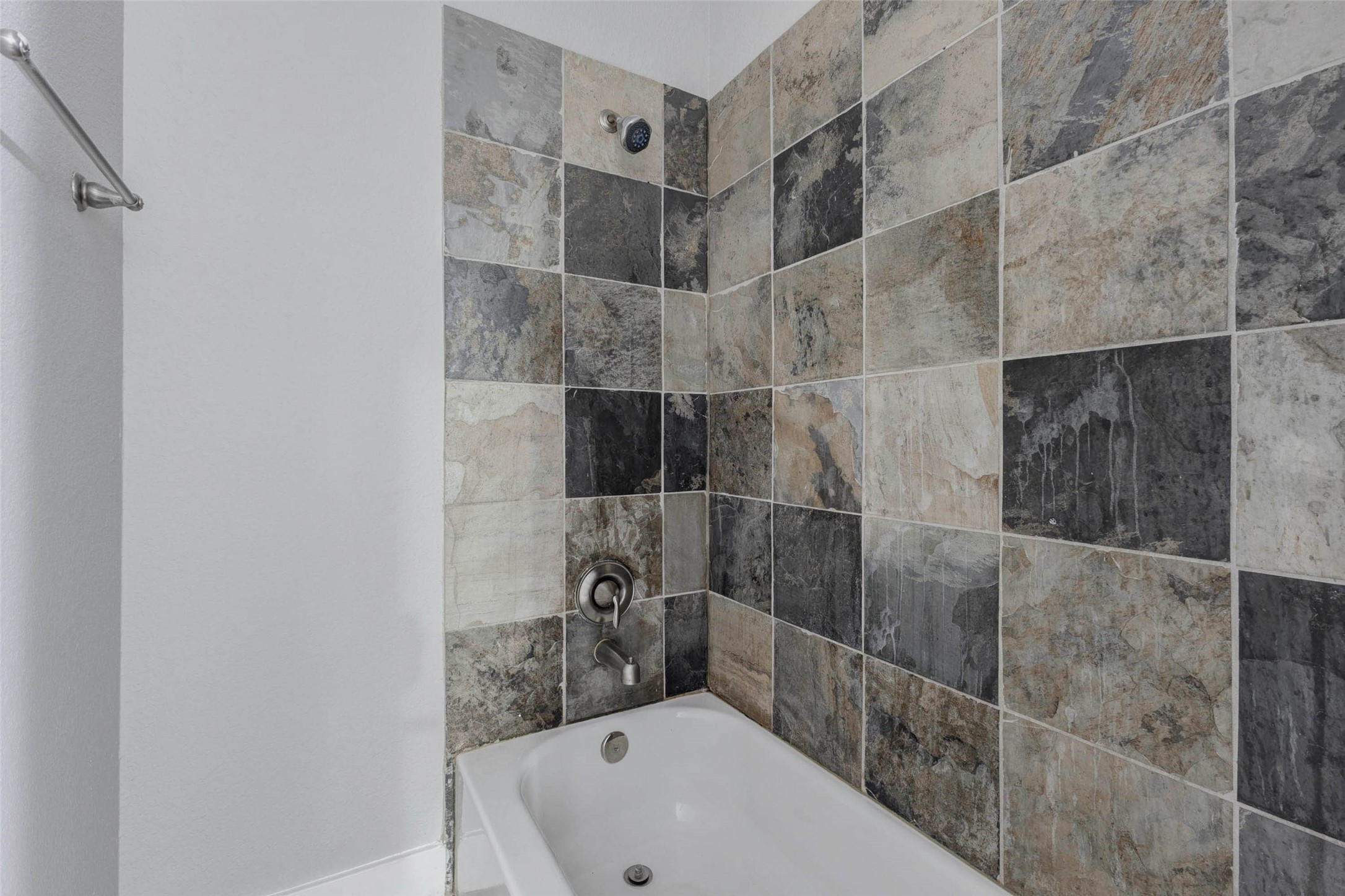 4834 Hollow Hook Road, Unit A Houston, TX 77041 - Photo 24 of 30 a bathroom with a bathtub and shower