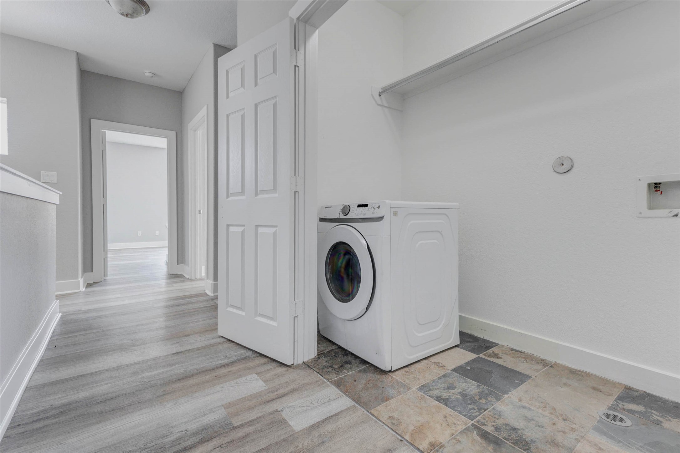 4834 Hollow Hook Road, Unit A Houston, TX 77041 - Photo 25 of 30 a utility room with washing machine and a view of bedroom