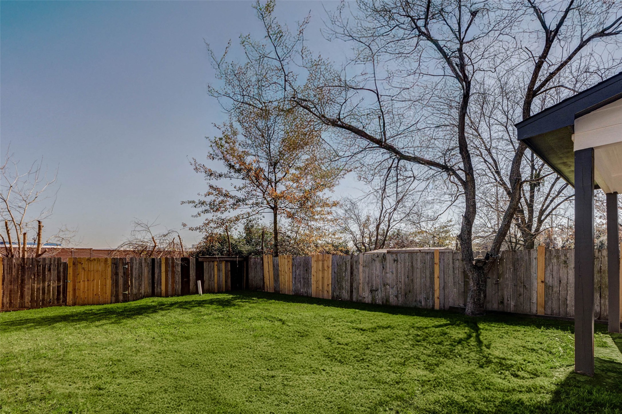 4834 Hollow Hook Road, Unit A Houston, TX 77041 - Photo 27 of 30 a backyard of a house with lots of green space