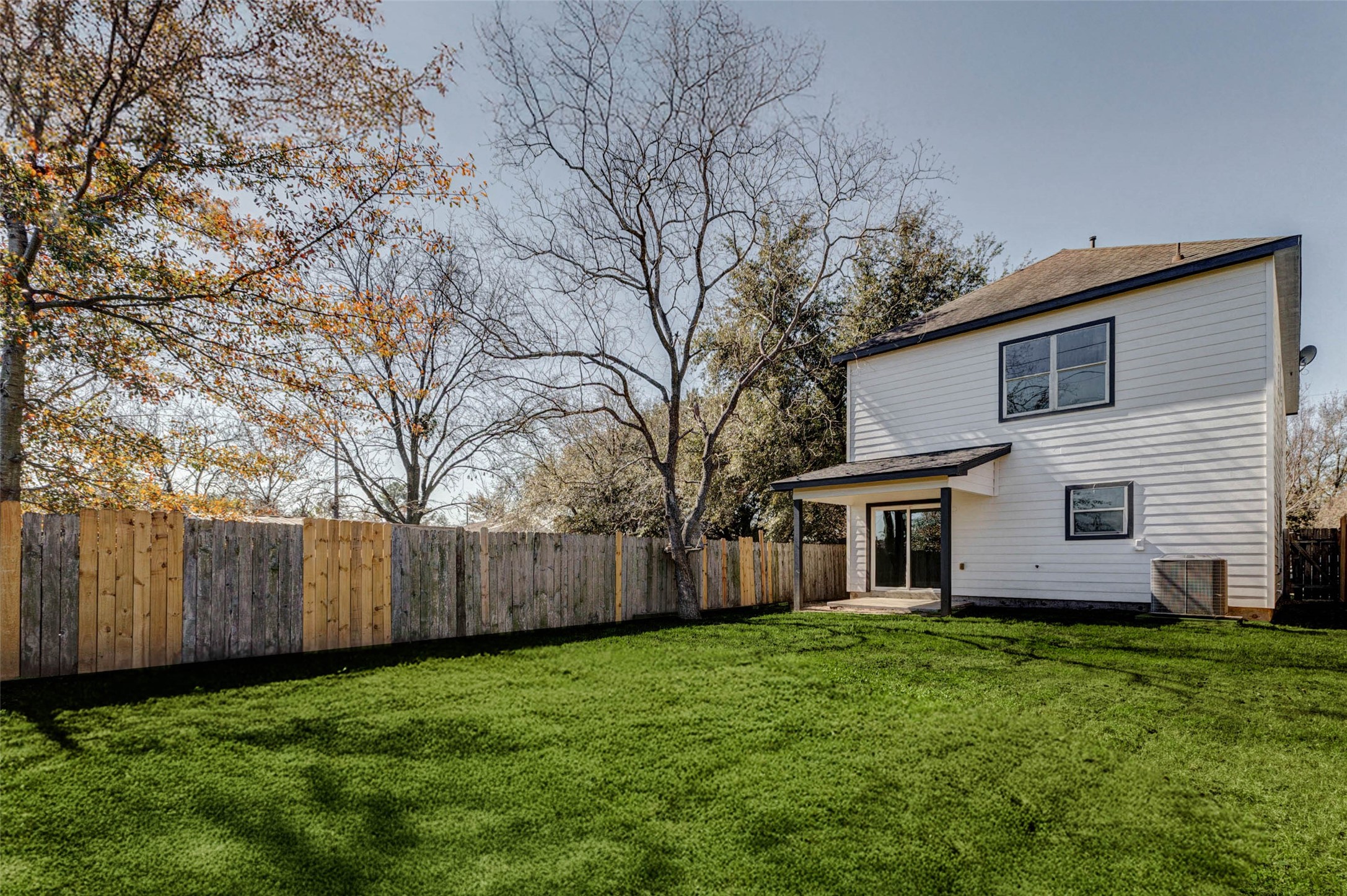 4834 Hollow Hook Road, Unit A Houston, TX 77041 - Photo 28 of 30 a view of a house with a backyard