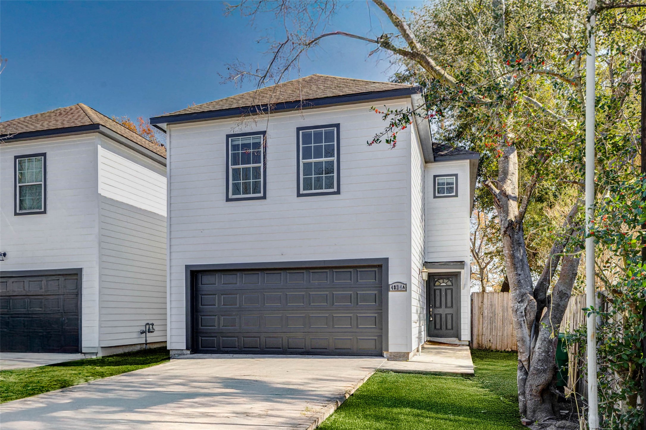 4834 Hollow Hook Road, Unit A Houston, TX 77041 - Photo 30 of 30 a front view of a house with a yard