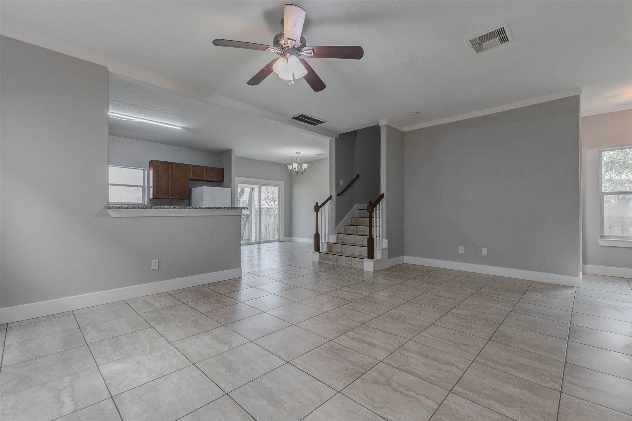 4834 Hollow Hook Road, Unit A Houston, TX 77041 - Photo 5 of 30 a view of a livingroom with a ceiling fan and wooden floor