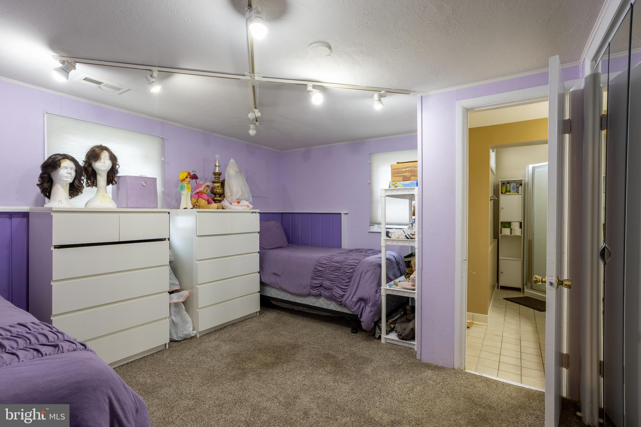 3215 Northbrook Road Baltimore, MD 21208 - Photo 35 of 50 a bedroom with a bed and a mirror