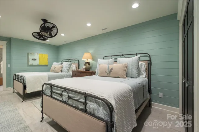 a bedroom with bed and a couch